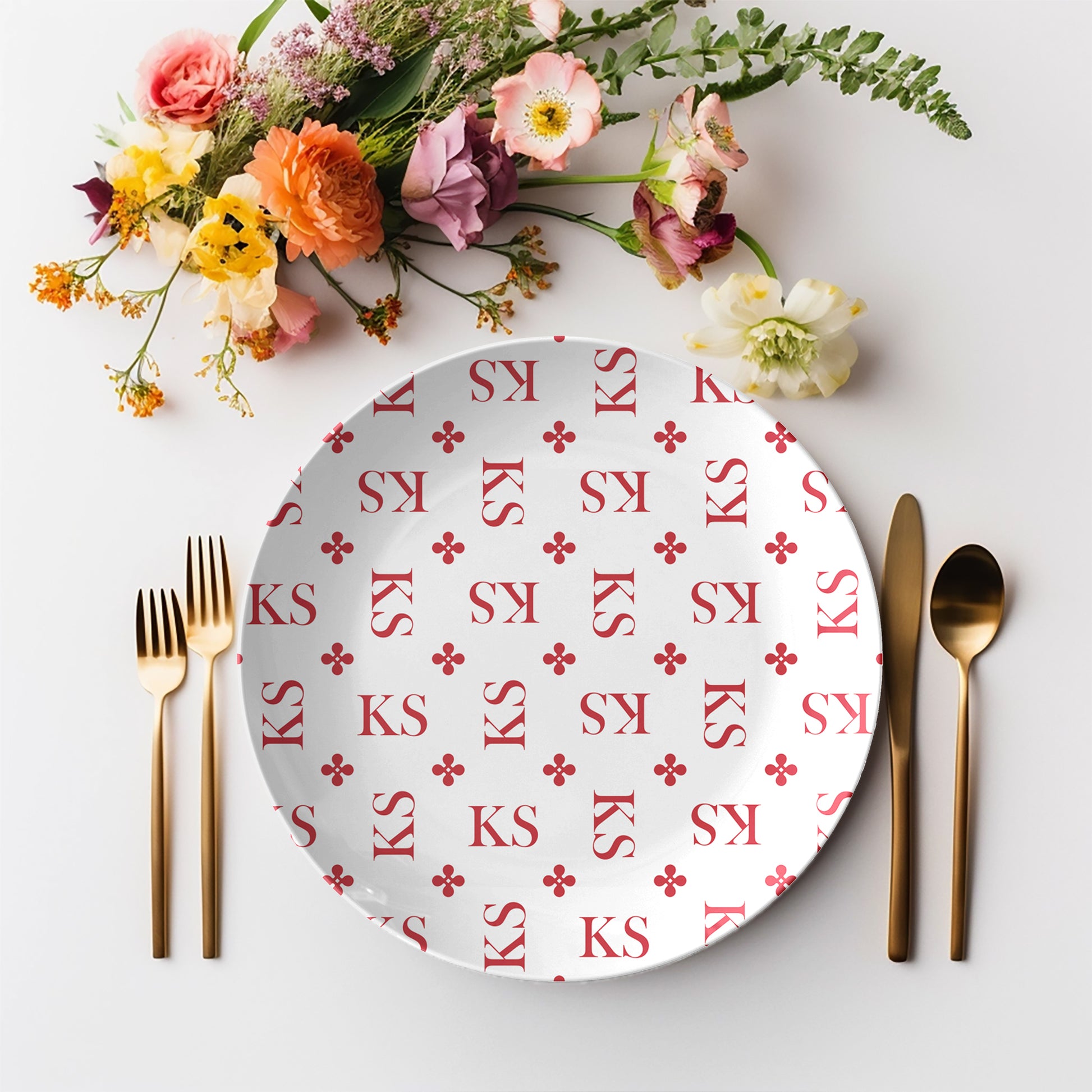 Personalized White and Red Stylized Monogram Plate Set features customized initials set in a repeating pattern accented with a stylish motif for an all-over, unique custom design.