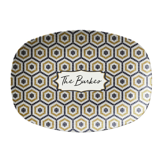 Oval serving platter in a bistro tile print with a hexagon pattern in black, gold and cream. Personalize with any custom text.