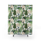 Shower curtain with a tropical design featuring trees, peacocks on a white background.