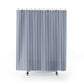 Striped shower curtain with blue and white vertical stripes on a white background