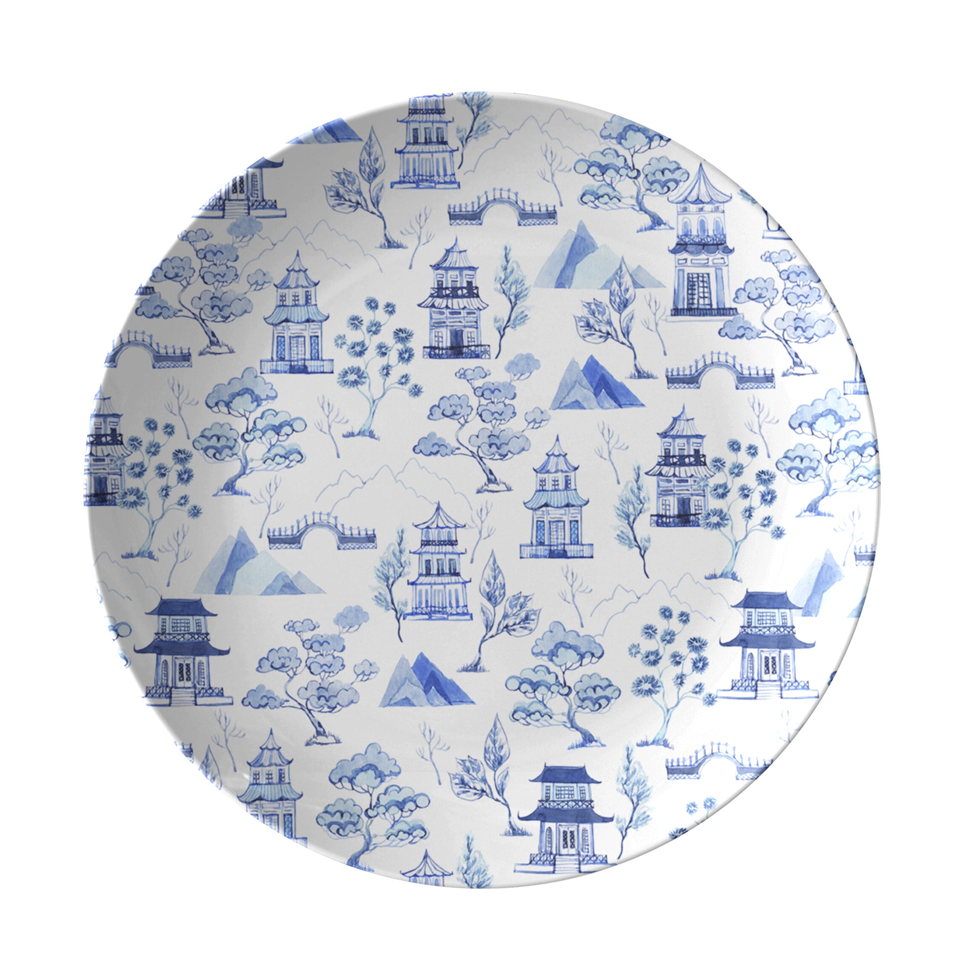 Blue chinoiserie toile pattern of pagodas and trees printed on white plate