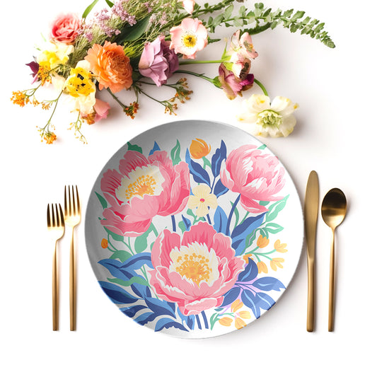 Floral peony patterned plate with cutlery and flowers on a white background