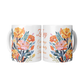 Two floral coffee mugs with colorful flower designs on a white background