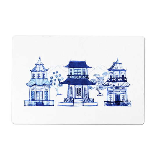 White rectangle pet placemat with a printed row of asian pagodas in blue and white.
