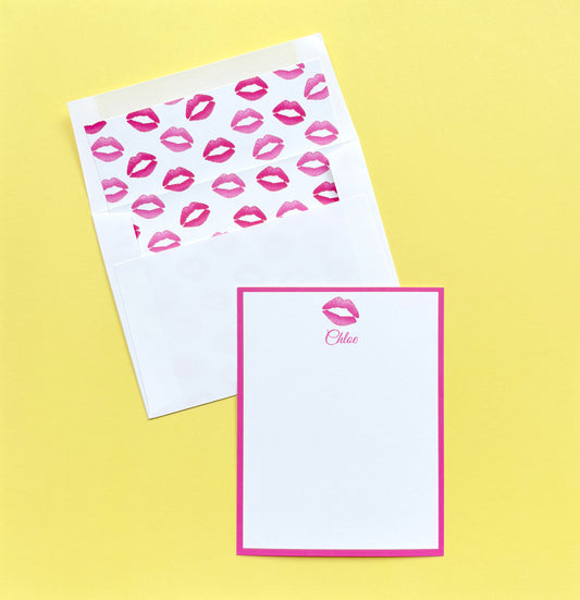 Personalized stationery set with pink lipstick kiss prints accents on a yellow background