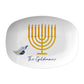 Personalized Hanukkah themed serving platter features a golden menorah and blue dove. Luxury plastic serveware.