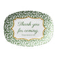 Oval serving platter has a green leopard print pattern and a funny saying that says "thank you for coming, please leave by nine". 