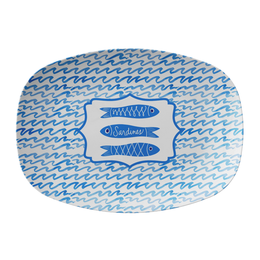 Oval platter with blue wave pattern and sardine illustration on a white background.