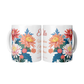 Two floral birth month flower mugs with colorful designs on a white background