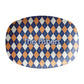 Diamond argyle pattern in navy and orange is  printed on an oval serving platter and can be personalized with any custom text.