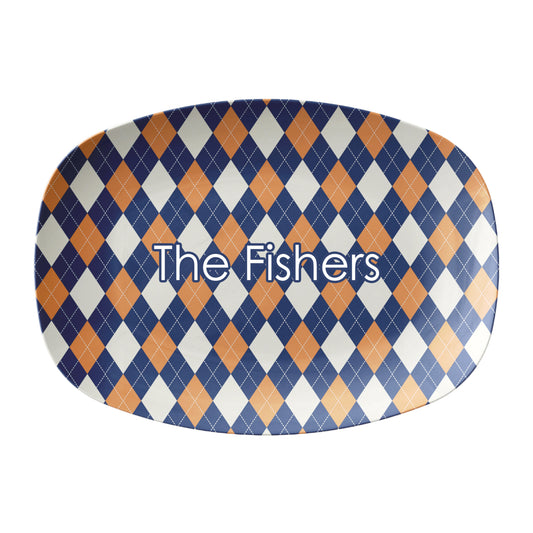 Diamond argyle pattern in navy and orange is  printed on an oval serving platter and can be personalized with any custom text.