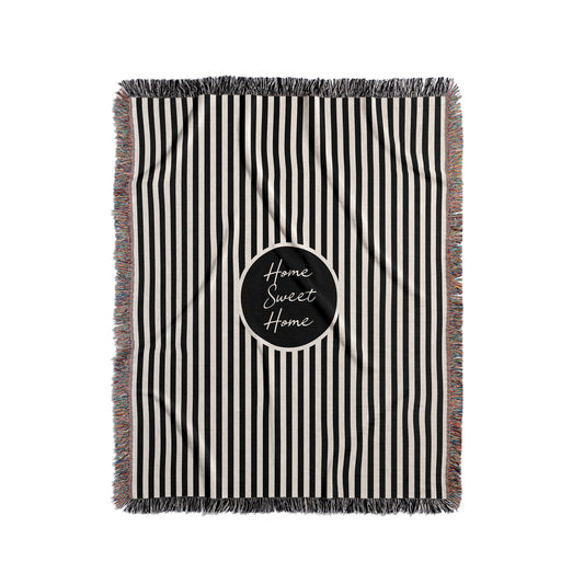 Personalized woven blanket with a black and cream stripes.