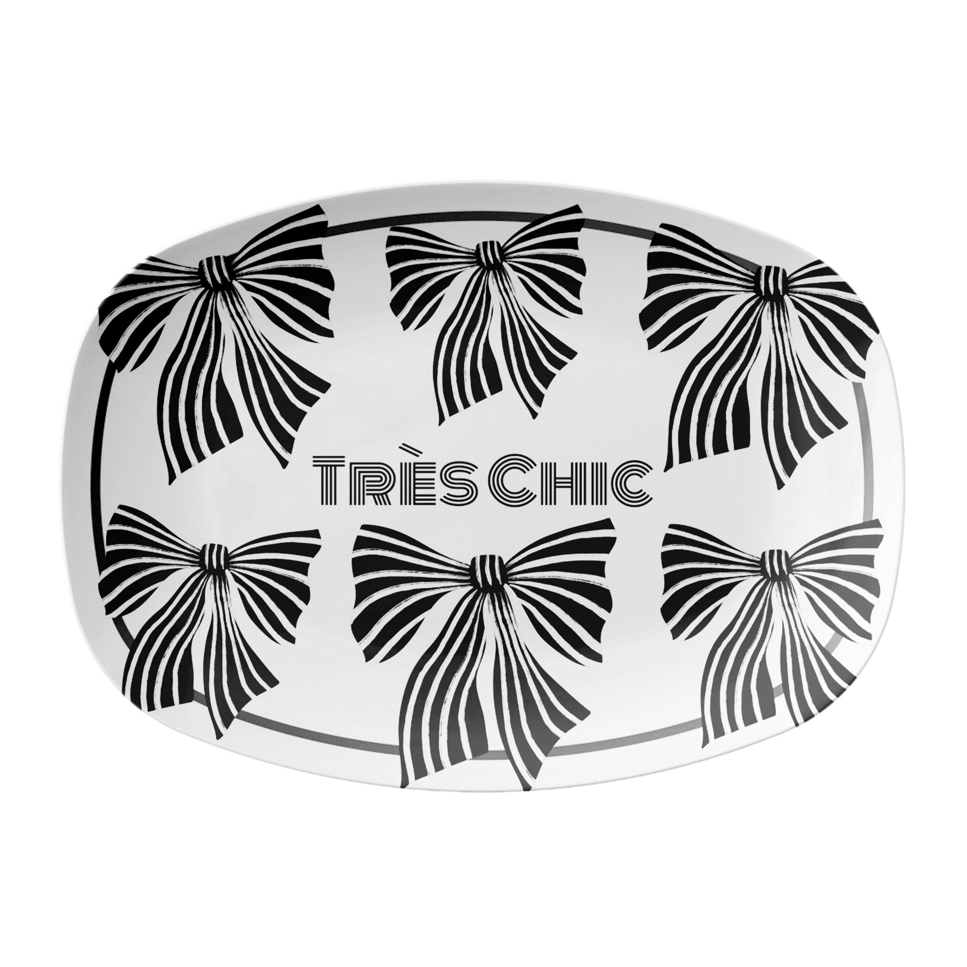 Decorative serving platter with black and white striped bow designs and 'Très Chic' text on a white background