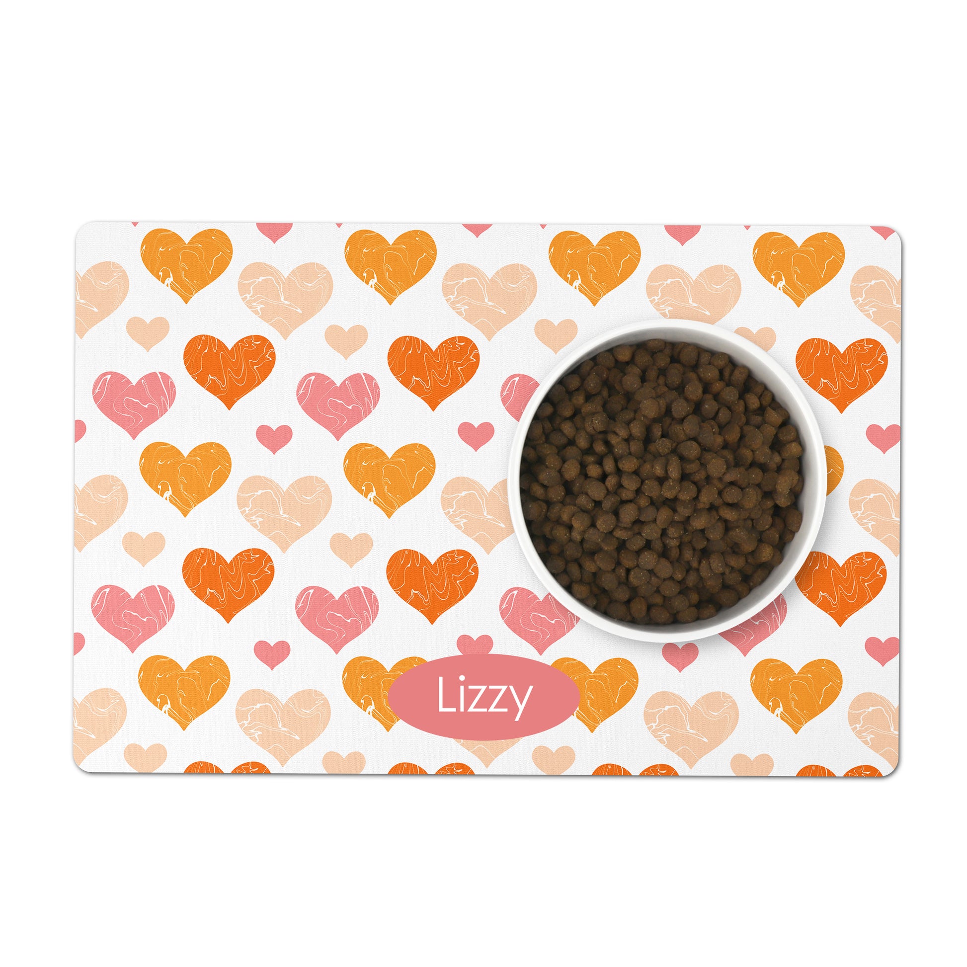 White pet placemat has orange and pink hearts printed all over it, add any custom name or text to personalize as a gift for your dog or cat.