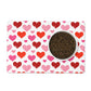 White pet placemat has red and pink hearts pattern printed all over.