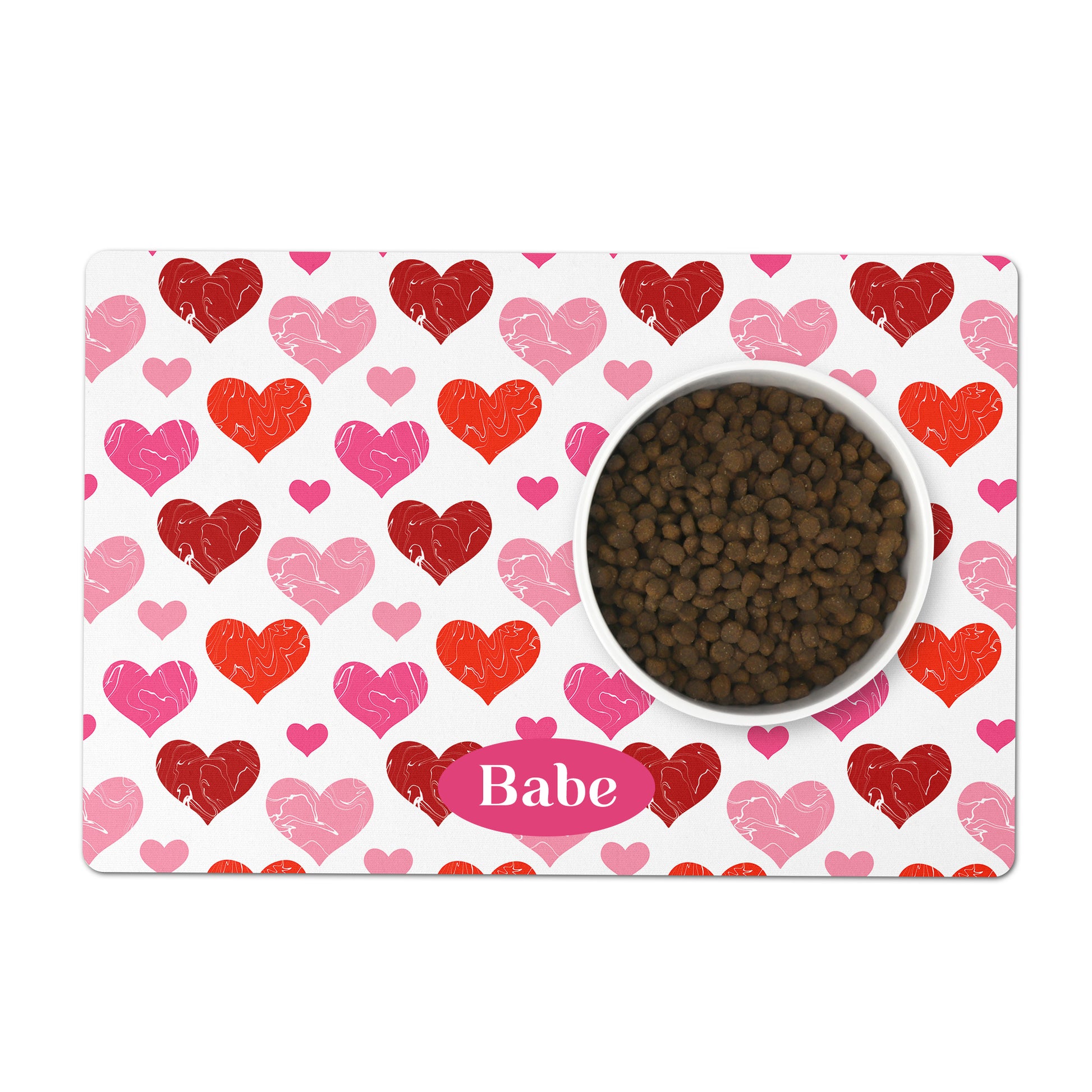 Red and pink hearts pattern printed on a white rectangle pet placemat personalized with any name or custom text.
