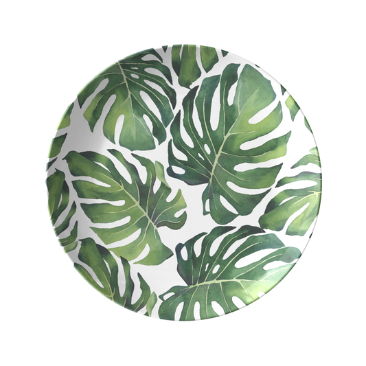 Palm leaves plastic dinner plate with mostera leaf print in green.