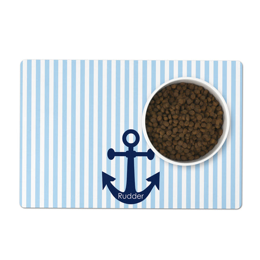 Pet bowl placemat with nautical blue and white stripes and personalized anchor motif with pet's name on white background