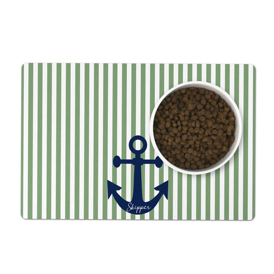 Green and white striped pet mat with a blue anchor and custom name, featuring a bowl of dog food.