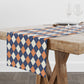 Table runner with geometric pattern on a wooden table