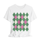 White t-shirt with green and pink argyle pattern on a white background