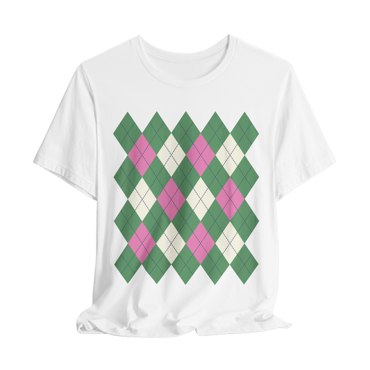 White t-shirt with green and pink argyle pattern on a white background