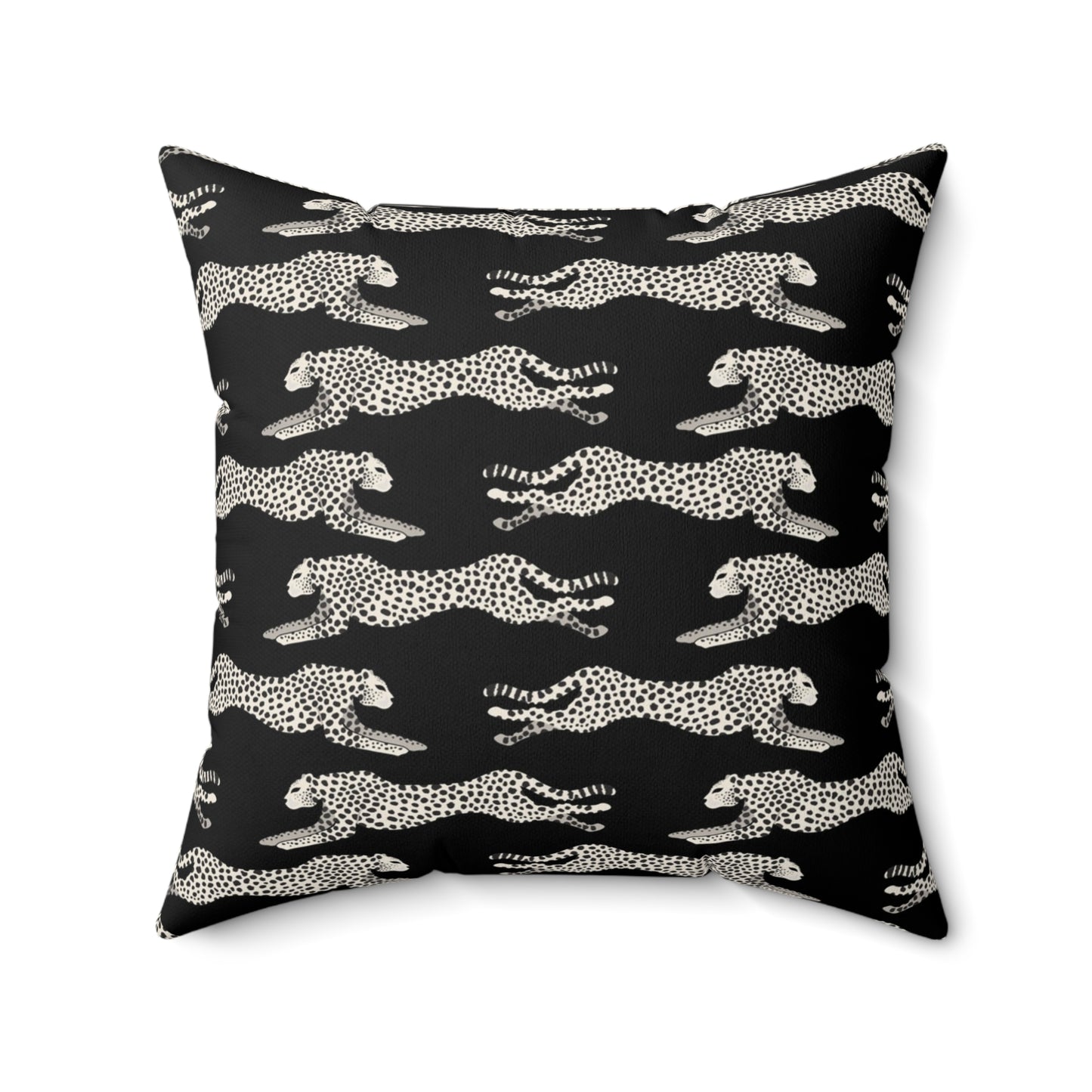 Black square throw pillow with off-white leaping cheetahs
