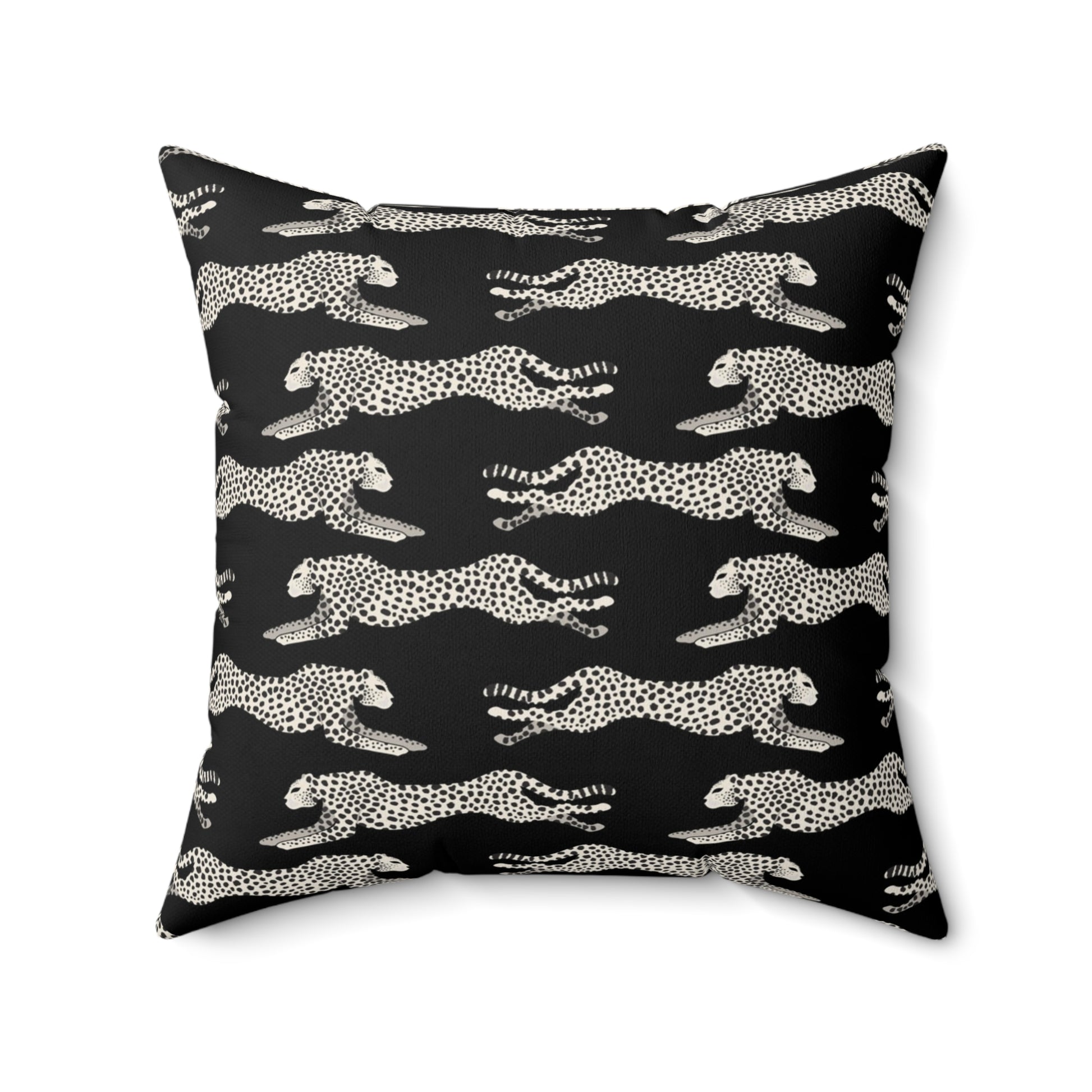 Black square throw pillow with off-white leaping cheetahs