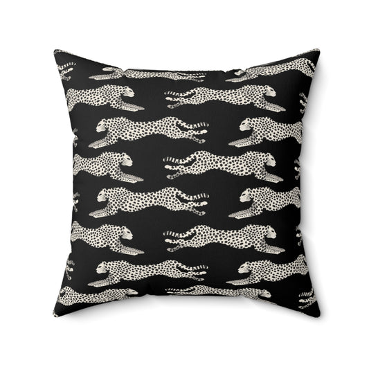 Black square throw pillow with off-white leaping cheetahs