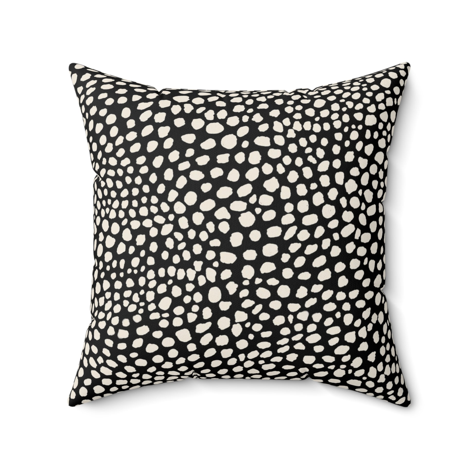 Square black throw pillow with warm white cream cheetah spots