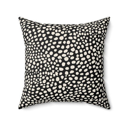 Square black throw pillow with warm white cream cheetah spots