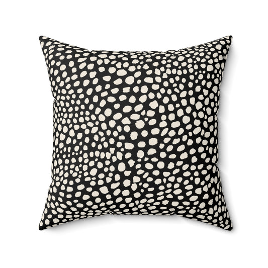 Square black throw pillow with warm white cream cheetah spots