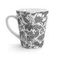 White mug with black floral batik pattern on a white background