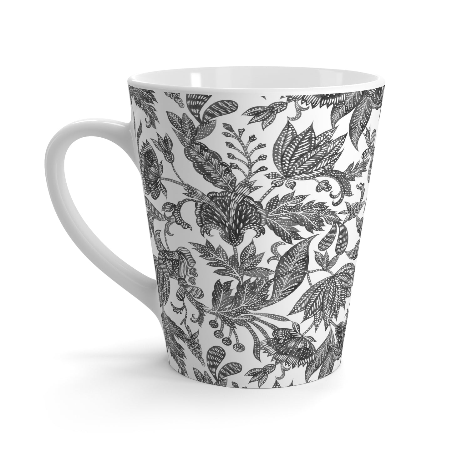 White mug with black floral batik pattern on a white background
