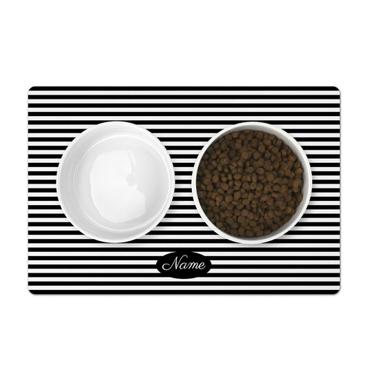 Personalized pet food mat with black and white stripes.
