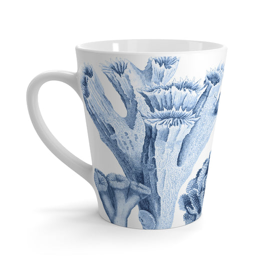 White ceramic latte coffee mug with blue coral pattern on a white background