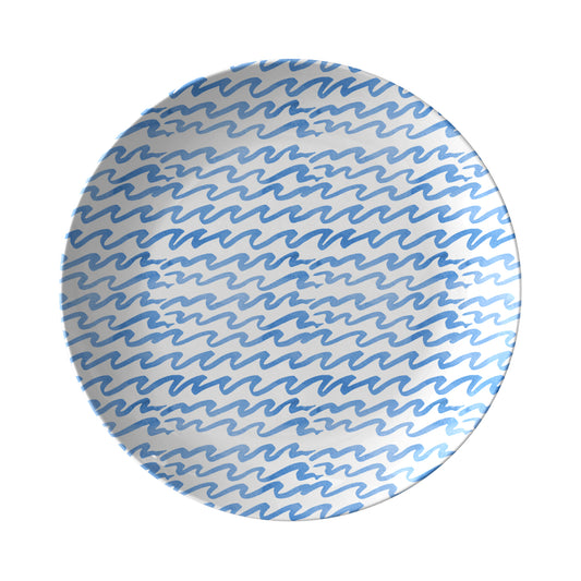 Round dinner plate with coastal blue wavy stipe pattern on a white background
