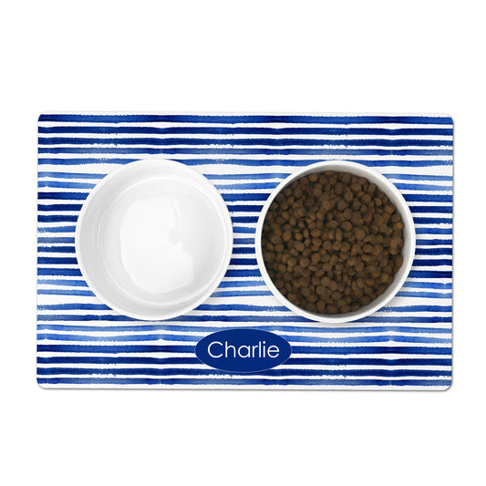 Blue and white striped pet placemat personalized with any name or word. Mat is shown with two bowls.