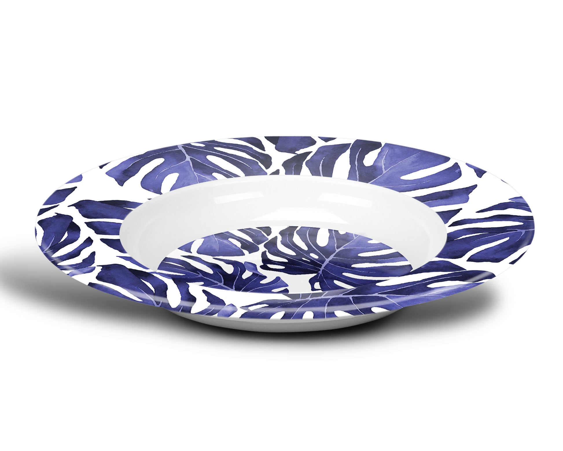 Wide rimmed plastic soup plate bowl with tropical leaf print in blue and white.