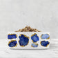 Blue and white ceramic dog bowl with sapphire jewels and god accents