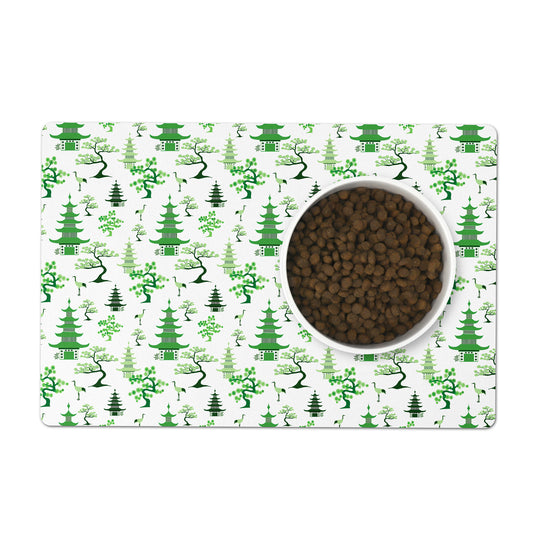 Green chinoiserie pet food bowl mat helps protect your floor.