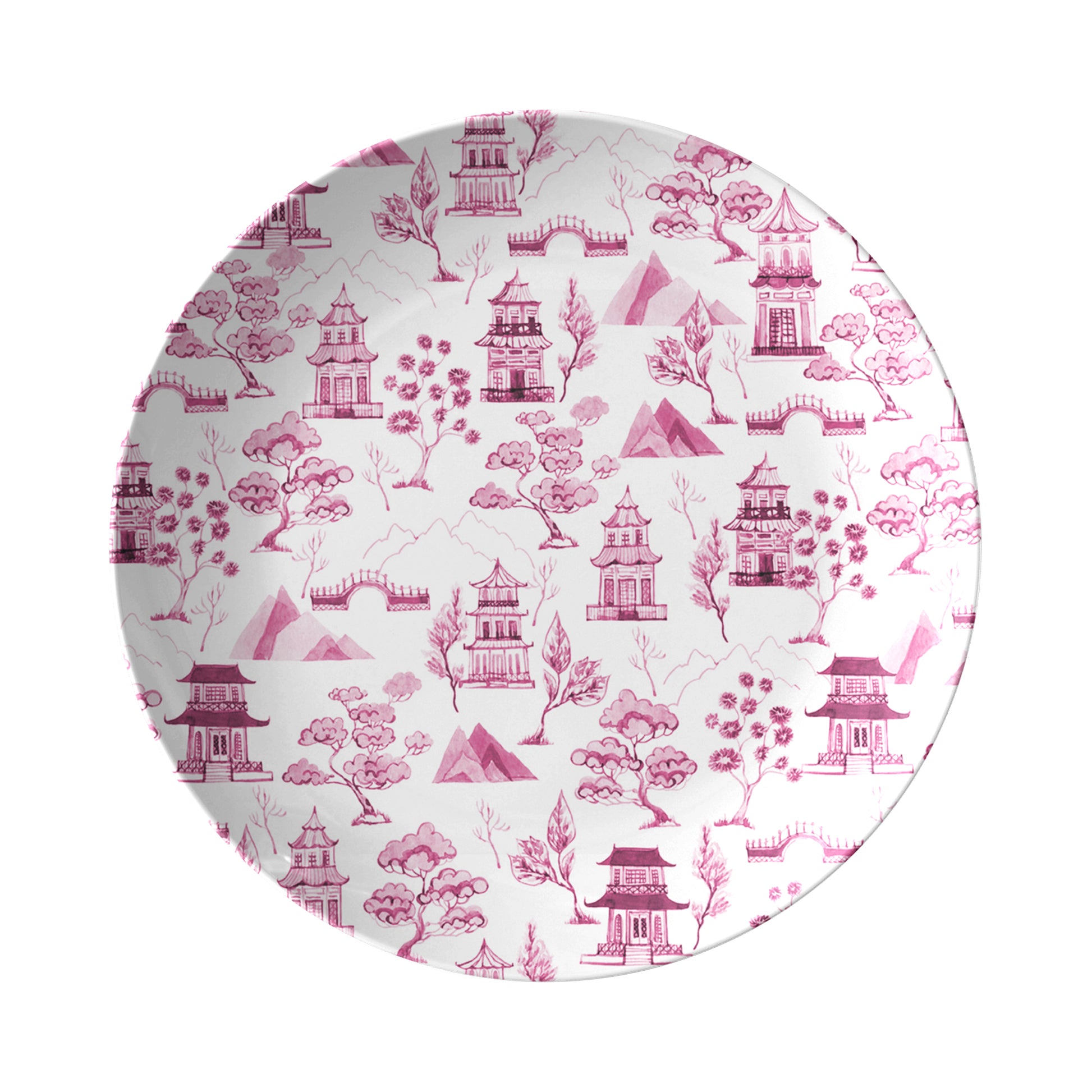 Pink chinoiserie toile plate features pagodas, trees, mountains and bridges printed on a white dinner plate.