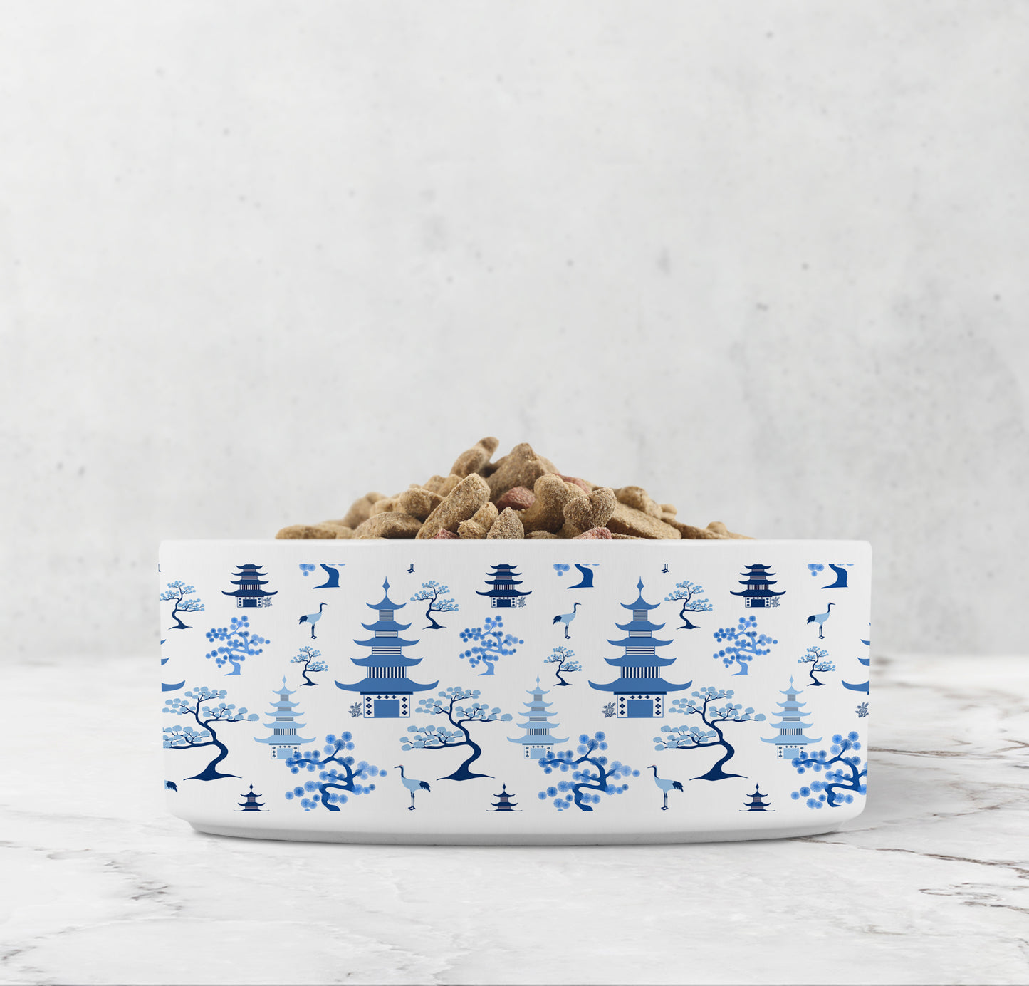 Modern chinoiserie dog food bowl or cat water bowl features blue and white pagodas,  bonsai trees and crane birds hand drawn by Alyssa Reuven.