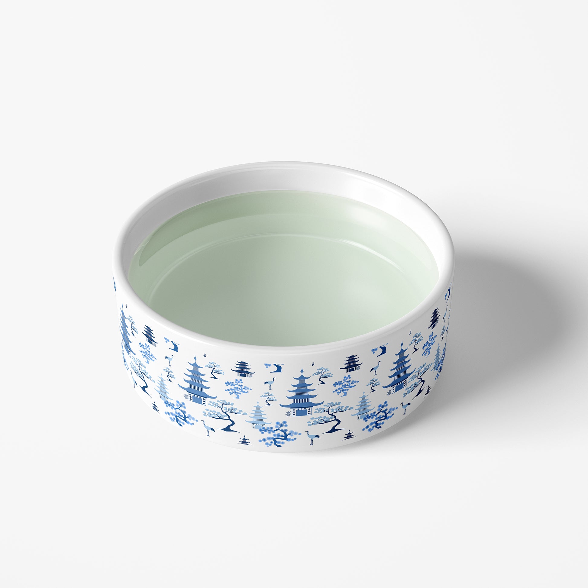 Large white ceramic dog bowl with chinoiserie toile print in blue and white