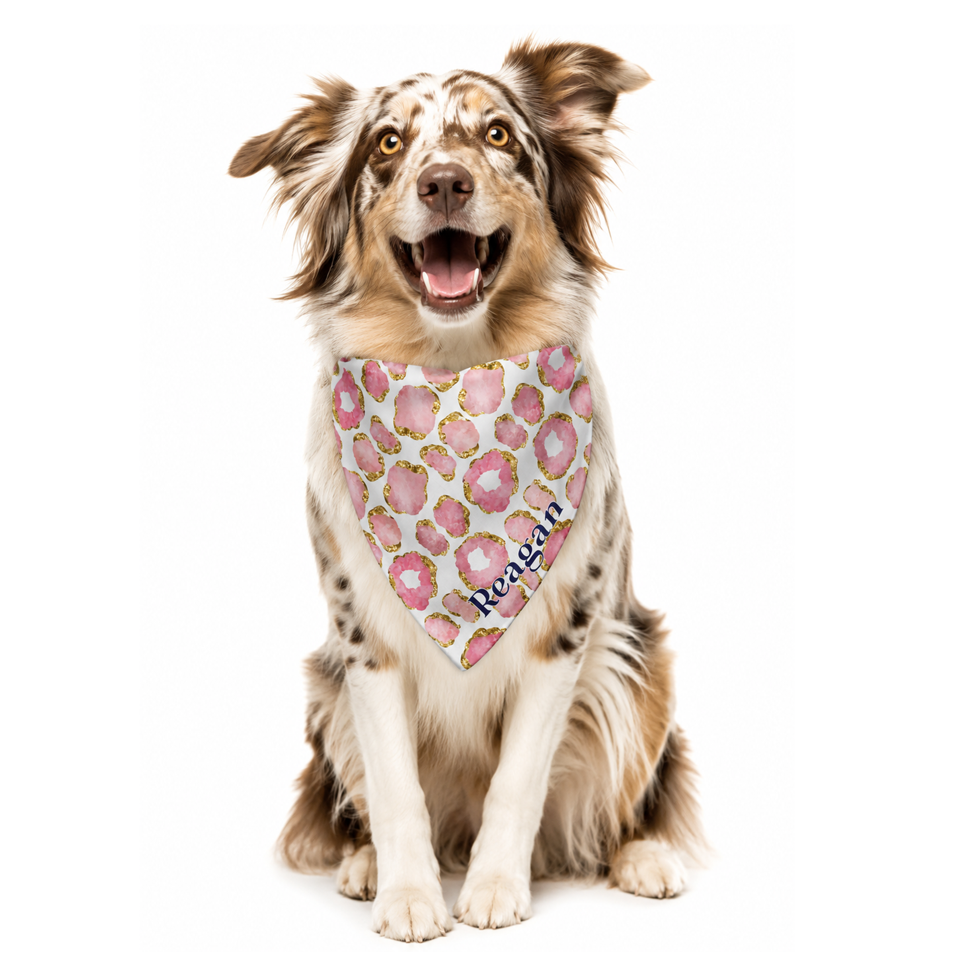 Dog wearing a pink and gold jewel print bandana customized with name against a white background