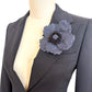 Handmade Blue Denim Wild Rose Brooch Pin on black jacket