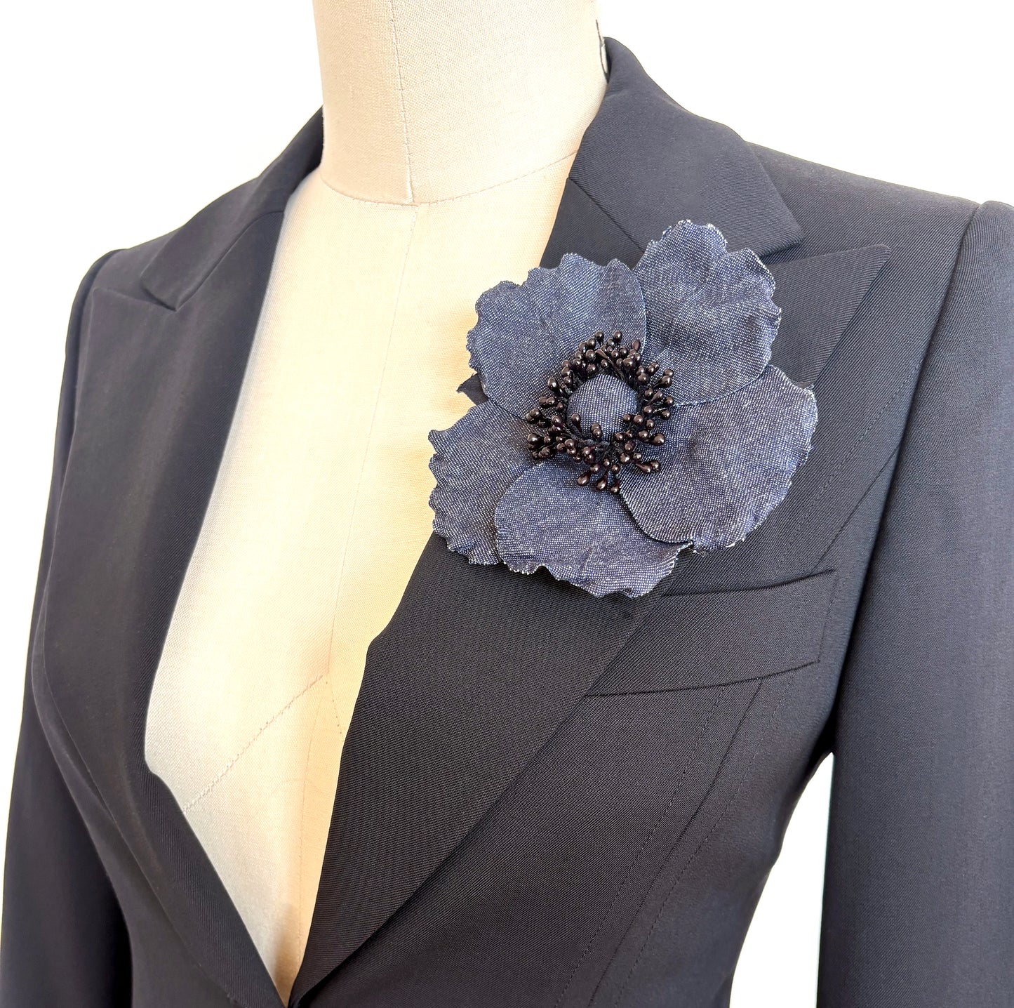 Handmade Blue Denim Wild Rose Brooch Pin on black jacket