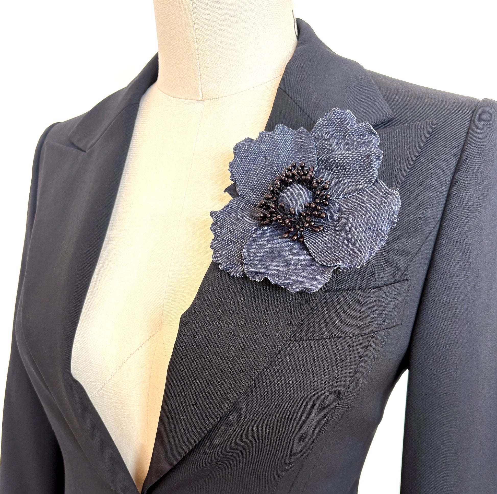 Handmade Blue Denim Wild Rose Brooch Pin on black jacket
