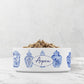 White ceramic pet dish has blue ginger jars printed all around the diameter and is personalized with any custom text.