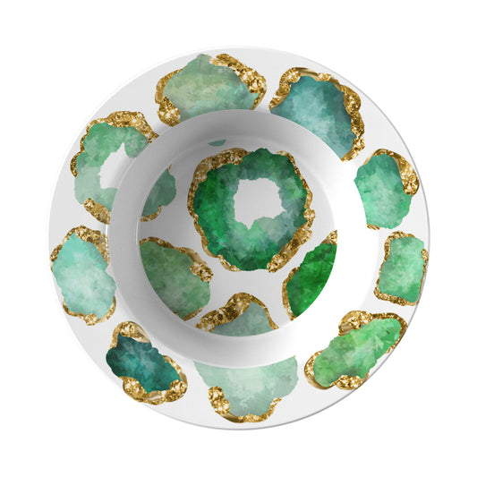 Rim soup style bowl has emerald green and gold crystal gemstones printed on a white background